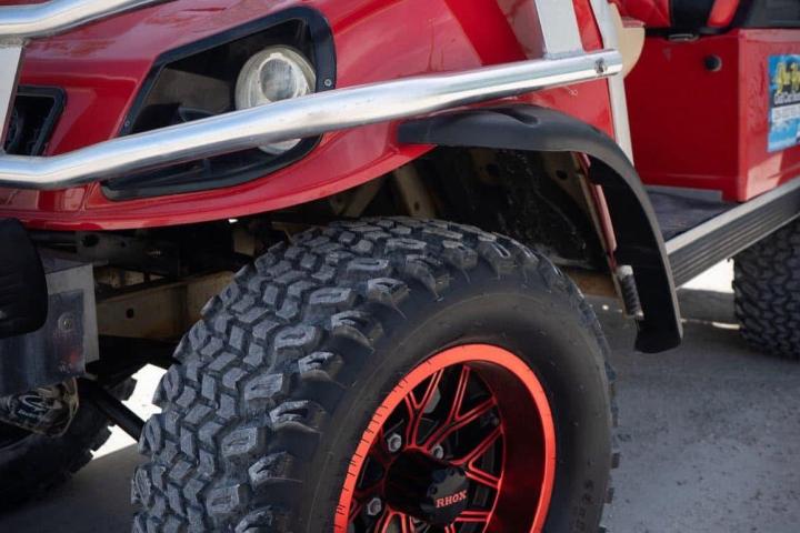 a motorcycle parked in front of a car