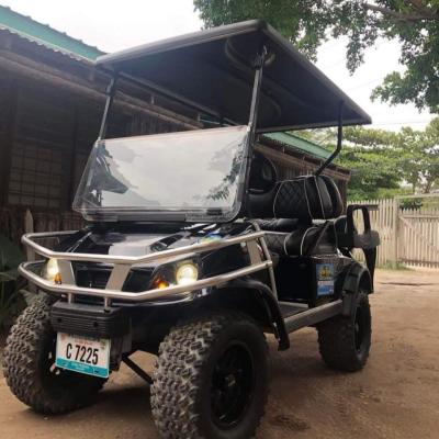 a truck driving down a dirt road